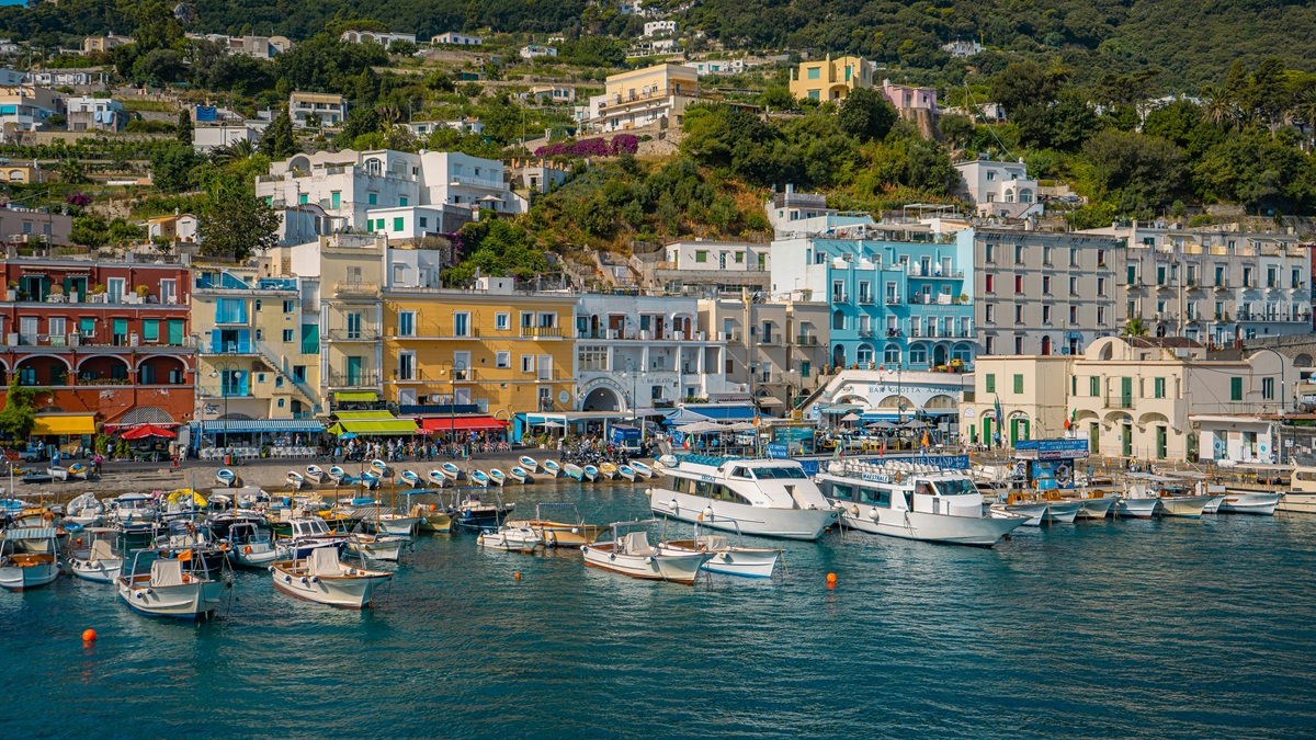 Capri — island chic and marina-front elegance, curated with private skippers, boutique afternoons, and unhurried timing